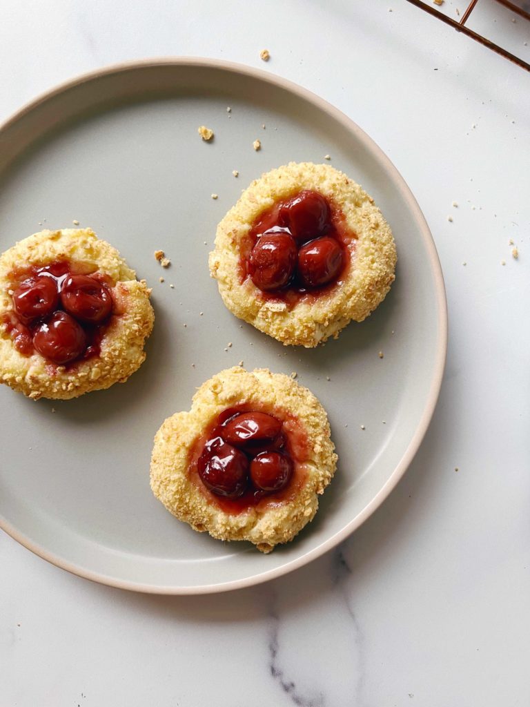 Bright, juicy Red Tart Cherries atop crumbly cheesecake cookies